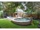 Beautiful backyard with an in-ground spa, patio area, and lush landscaping at 1125 Francis Ne St, Brookhaven, GA 30319