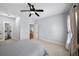 This bedroom features neutral walls, a ceiling fan, and an adjacent bathroom at 1125 Francis Ne St, Brookhaven, GA 30319
