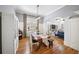 Bright dining room includes hardwood floors, large windows, classic wainscoting, and seamless flow into other spaces at 1125 Francis Ne St, Brookhaven, GA 30319