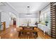 Bright dining room features hardwood floors, natural light, and classic wainscoting for elegant gatherings at 1125 Francis Ne St, Brookhaven, GA 30319