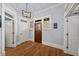 Light-filled foyer with hardwood floors, white trim, and classic wood entry door at 1125 Francis Ne St, Brookhaven, GA 30319
