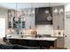 Beautiful kitchen with a large island, stainless steel appliances, a brick backsplash, and bar shelving for entertaining at 1125 Francis Ne St, Brookhaven, GA 30319