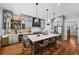 Spacious kitchen boasts a large island with seating, quartz countertops, stainless appliances, and stylish gray cabinets at 1125 Francis Ne St, Brookhaven, GA 30319