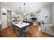 Open concept kitchen features a large island with seating, modern appliances, and seamless flow into the living room at 1125 Francis Ne St, Brookhaven, GA 30319