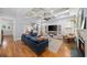 Spacious living room with fireplace, hardwood floors, and an open concept design at 1125 Francis Ne St, Brookhaven, GA 30319