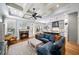 Elegant living room featuring a coffered ceiling, fireplace, and seamless flow to the kitchen at 1125 Francis Ne St, Brookhaven, GA 30319