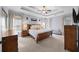 Serene main bedroom offers a ceiling fan, plush carpeting, and multiple windows offering abundant natural light at 1125 Francis Ne St, Brookhaven, GA 30319