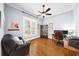 Home office features hardwood floors, a ceiling fan, natural light, and ample space for productivity at 1125 Francis Ne St, Brookhaven, GA 30319
