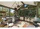 Entertainer's outdoor kitchen with bar seating, overhead fan, and built-in barbeque grill at 1125 Francis Ne St, Brookhaven, GA 30319