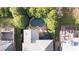 Aerial view of backyard pool with patio and lounge chairs surrounded by mature trees at 1125 Francis Ne St, Brookhaven, GA 30319