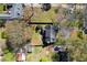 Overhead view of a house with a well-kept yard, driveway, and mature trees, perfect for outdoor living at 235 Chicopee Ne Dr, Marietta, GA 30060