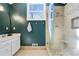 Well-lit bathroom featuring a glass-enclosed shower, modern vanity, and stylish fixtures at 235 Chicopee Ne Dr, Marietta, GA 30060
