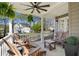 Relax on the covered front porch with comfortable seating and views of the landscaped yard at 235 Chicopee Ne Dr, Marietta, GA 30060