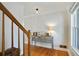 Hallway featuring hardwood floors, a console table, and natural light from a nearby window at 235 Chicopee Ne Dr, Marietta, GA 30060