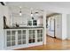 Charming kitchen with white cabinets, glass-front display cases, and stainless-steel appliances at 235 Chicopee Ne Dr, Marietta, GA 30060