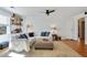 Bright living room with hardwood floors, a ceiling fan, and comfortable seating arrangement at 235 Chicopee Ne Dr, Marietta, GA 30060