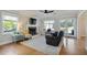 Spacious living room showcasing hardwood floors, a fireplace, and plenty of natural light at 235 Chicopee Ne Dr, Marietta, GA 30060