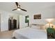 Relaxing main bedroom featuring neutral tones, ceiling fan, and connecting bathroom at 235 Chicopee Ne Dr, Marietta, GA 30060