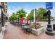 Charming street view with outdoor seating, vibrant umbrellas, and a welcoming ambiance for dining and socializing at 235 Chicopee Ne Dr, Marietta, GA 30060