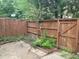 Enclosed backyard area featuring a privacy fence, pavers and a young tree with pink blossoms at 6354 Shannon Pkwy # 15D, Union City, GA 30291