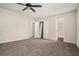 Large bedroom with carpet flooring, ceiling fan, and multiple closets at 6354 Shannon Pkwy # 15D, Union City, GA 30291