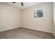 Neutral bedroom with window and carpet floors and ceiling fan at 6354 Shannon Pkwy # 15D, Union City, GA 30291