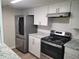 Modern kitchen boasts stainless steel appliances and granite countertops at 6354 Shannon Pkwy # 15D, Union City, GA 30291