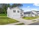 Charming two-story home boasts a two-car garage and a well-maintained, green lawn at 8595 Secretariat Dr, Lithonia, GA 30058