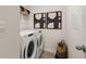 Efficient laundry room equipped with modern washer and dryer units for convenient chore management at 8595 Secretariat Dr, Lithonia, GA 30058