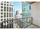 A view from a condo balcony features nearby buildings and a glimpse of the bustling city below at 943 Peachtree Ne St # 1003, Atlanta, GA 30309