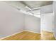 This bedroom showcases hardwood floors, a raw concrete ceiling, and ample natural light at 943 Peachtree Ne St # 1003, Atlanta, GA 30309