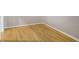 Clean and classic hardwood flooring with white trim is shown in this listing photo at 943 Peachtree Ne St # 1003, Atlanta, GA 30309