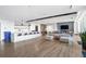 Bright, open-concept living area with a long bar, sleek countertops, and modern furnishings at 943 Peachtree Ne St # 1003, Atlanta, GA 30309