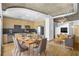 Open-concept living space with dining table adjacent to the well-equipped kitchen with stainless appliances at 943 Peachtree Ne St # 1003, Atlanta, GA 30309