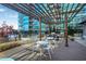 Outdoor seating area with tables, chairs, grills, and pergola, perfect for relaxing and dining at 943 Peachtree Ne St # 1003, Atlanta, GA 30309