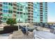 Spacious rooftop terrace with comfortable seating, a fire pit, and stunning city views at 943 Peachtree Ne St # 1003, Atlanta, GA 30309