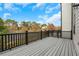 Private wooden deck with a view of nature, trees, and a parking lot at , Lawrenceville, GA 30046