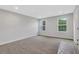 Neutral bedroom features carpeted floors, baseboards, and natural light at , Lawrenceville, GA 30046