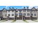 Charming brick townhomes feature symmetrical windows, private garage, and inviting curb appeal at , Lawrenceville, GA 30046