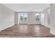 Open living area features hardwood floors, natural light, and neutral paint at , Lawrenceville, GA 30046