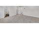 Large, carpeted bedroom featuring a neutral color palette, closet, and an en suite bathroom at , Lawrenceville, GA 30046