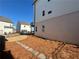 A clean backyard featuring stepping stones and a tasteful blend of brick and siding on the home's exterior at 122 Stonehouse Dr, Cumming, GA 30040
