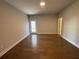 Unfinished basement with hardwood floors, rear entrance, and recessed lights at 122 Stonehouse Dr, Cumming, GA 30040