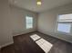 Bedroom features carpet, two windows, and overhead light at 122 Stonehouse Dr, Cumming, GA 30040