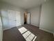 Bedroom features carpet, 2 door closet, and doorway at 122 Stonehouse Dr, Cumming, GA 30040