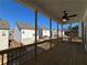 Covered porch with wood ceiling and flooring, looking out to backyard at 122 Stonehouse Dr, Cumming, GA 30040