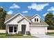 Charming home exterior with a well-manicured lawn, stone accents, and a two-car garage, perfect for suburban living at 2055 Ripple Park Bnd, Canton, GA 30114