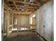Interior view showcasing the framing and insulation, highlighting the home's construction process at 2055 Ripple Park Bend, Canton, GA 30114