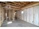 An interior view showcasing the framing of the space and insulation, and construction of the home at 2055 Ripple Park Bend, Canton, GA 30114