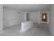 Spacious living room with unfinished flooring and ample natural light at 2055 Ripple Park Bnd, Canton, GA 30114